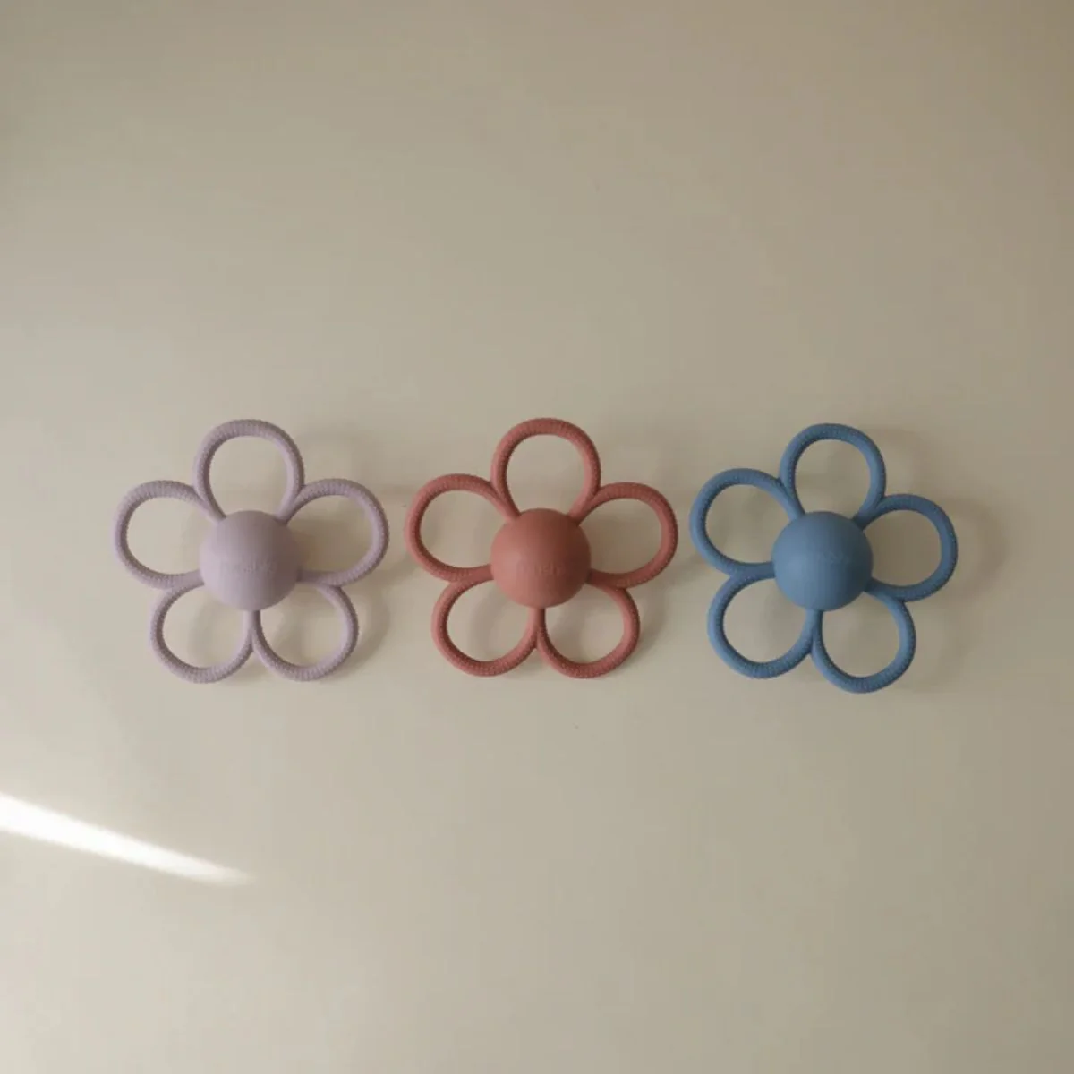 Mushie Silicone Daisy Rattle Teether - Dusty Rose - Image 4